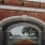 a brick archway with bells