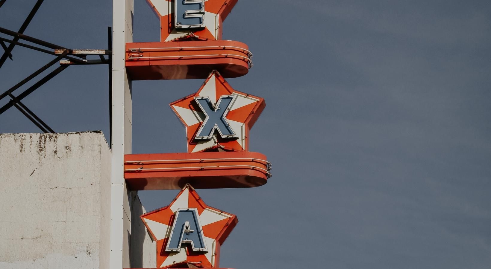 The essence of exceptional living Texas sign