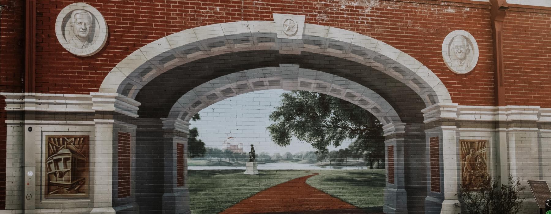 a brick archway with bells