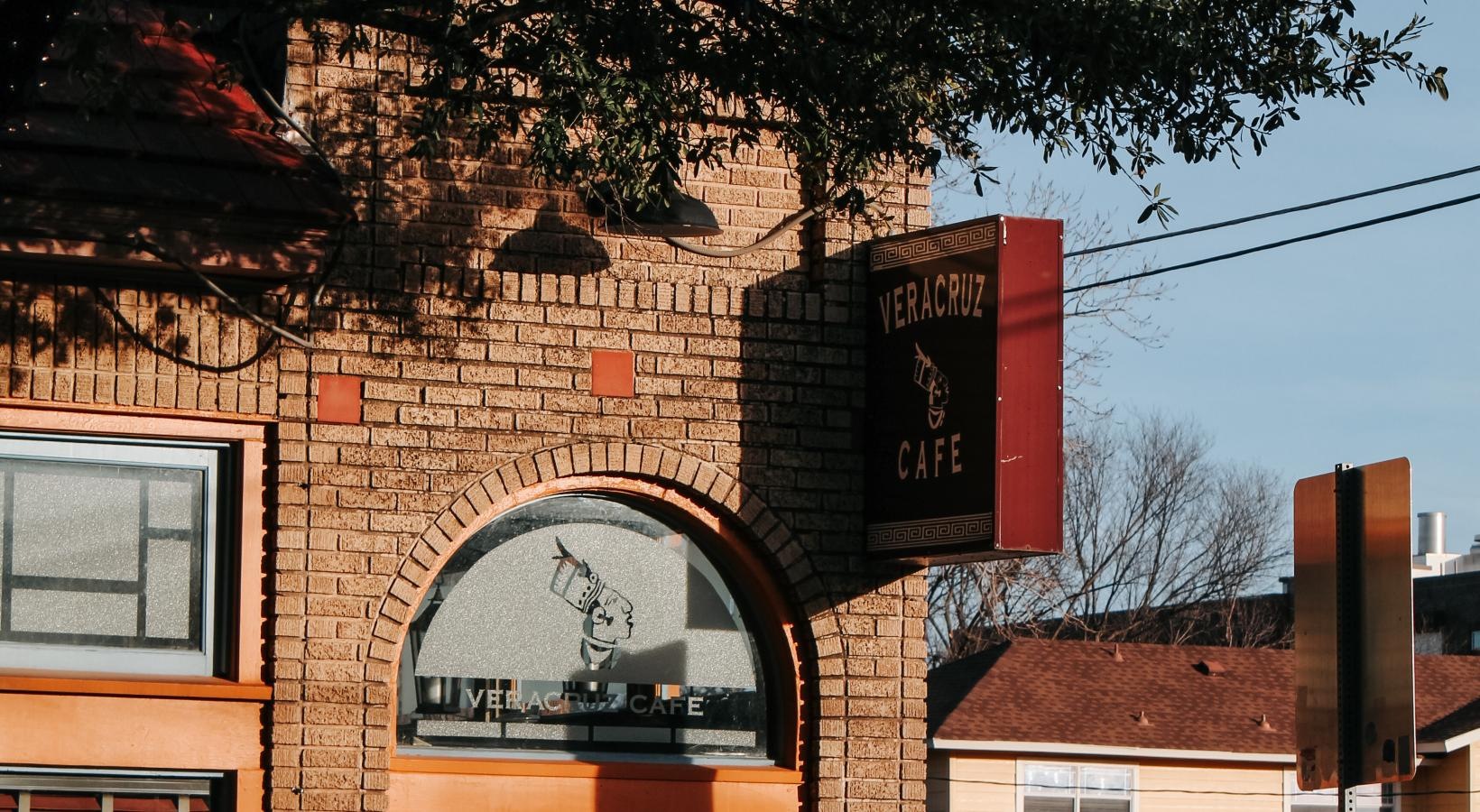 Close to the center of everything a brick building with a sign on it